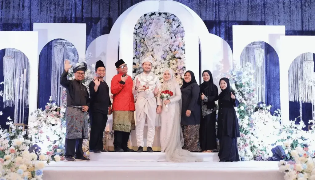 A family photo taken during a wedding ceremony.