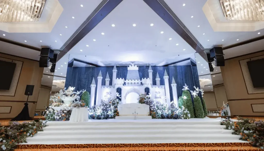 A wedding dais with stunning castle-themed decorations.