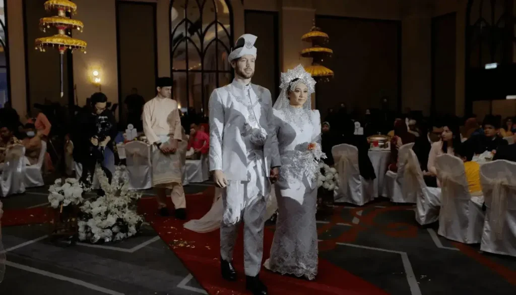 The bride and groom entering the hall.
