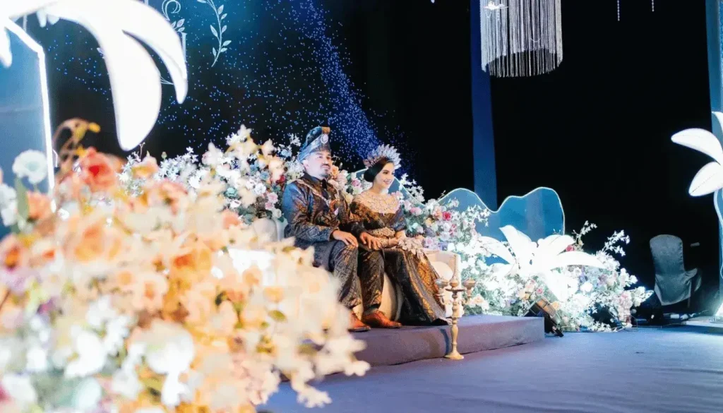 The concept of a wedding dais with floral decorations for a wedding in Putrajaya.